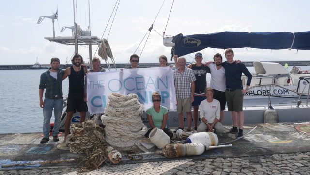The crew of vertical distribution expedition #6 after arrival at the Azores, showing the biggest plastics they collected.