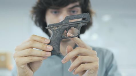 Boyan Slat holding a gun