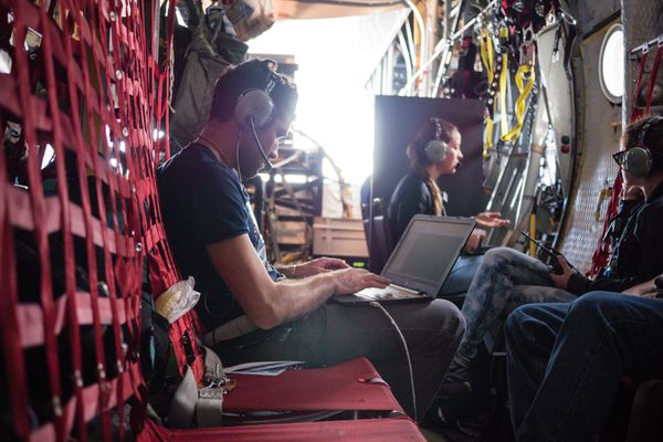 Lead Oceanographer Laurent Lebreton logging data aboard the Ocean Force One during the Aerial Expedition, 2016.