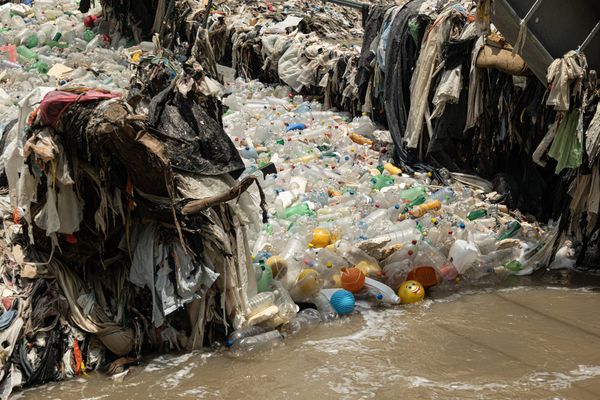 Trash that accumulated along the Interceptor Trashfence in Rio Las Vacas, Guatemala, May 2022