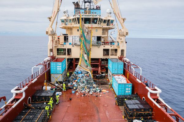 Plastic being dumped on deck from System 002, The Ocean Cleanup's ocean cleanup system.