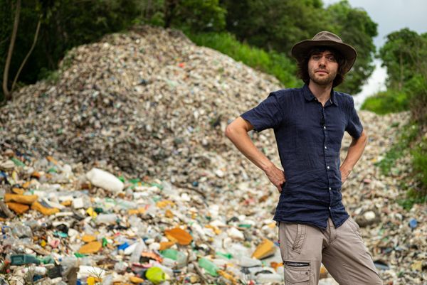 Boyan Slat, founder and CEO of The Ocean Cleanup standing in the river Las Vacas in Guatemala