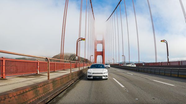 Kia electric vehicle driving over the Golden Gate bridge