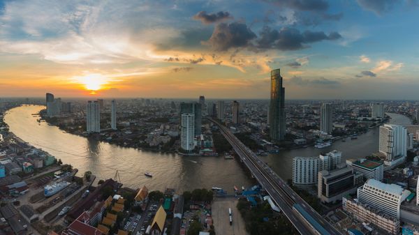 Panorama, aerial view Bangkok river curved with sunset background
