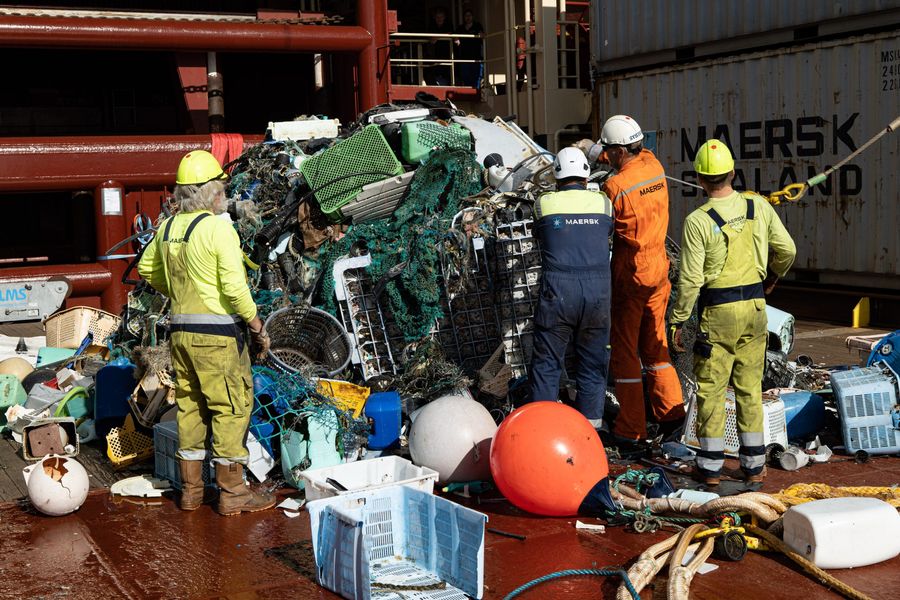 Plastic extraction from System 002, The Ocean Cleanup’s ocean system cleaning the Great Pacific Garbage Patch. Many crates and buoys originating from fishing activities can be seen in the catch.