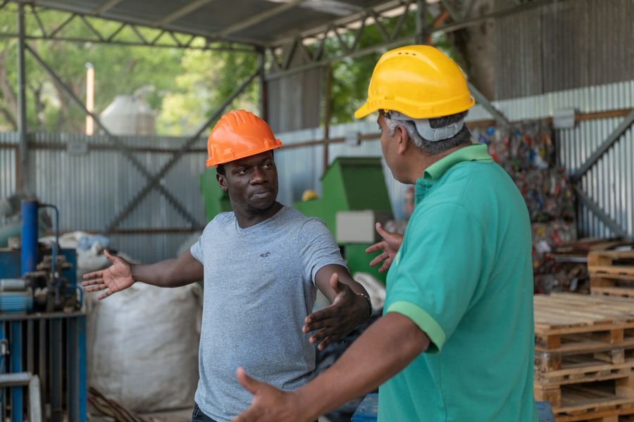 Waste Manager Enock Namwoyo (left) from The Ocean Cleanup at the BiosferaGT sorting center