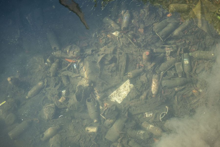 Plastic bottles filled with liquids sunken to the seabed