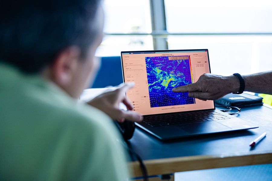 Crew members looking at plastic hotspots for System 002