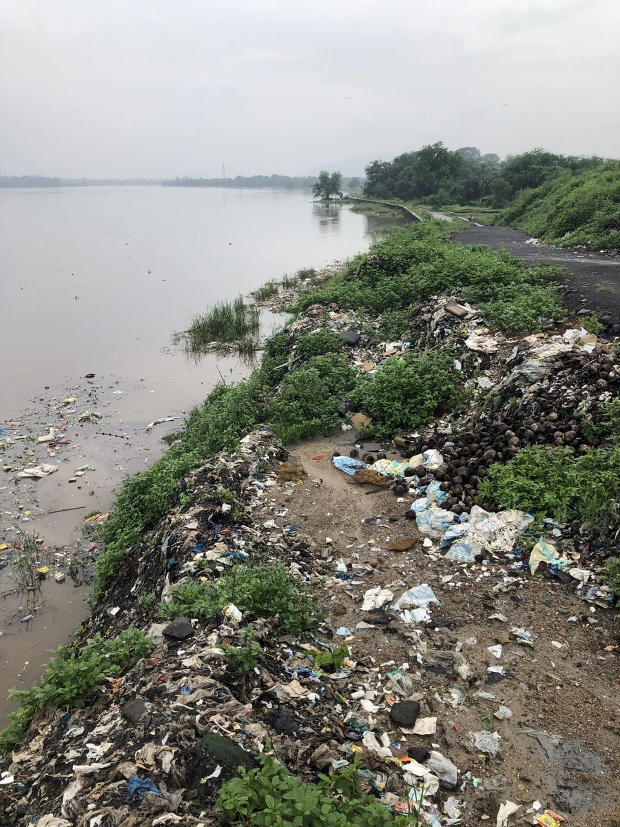 Plastic pollution along the riverbank in Mumbai, India