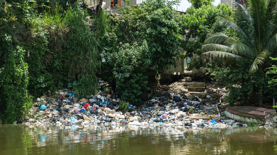 Plastic pollution on a river bank close to one of The Ocean Cleanup's Interceptors in Dominican Republic