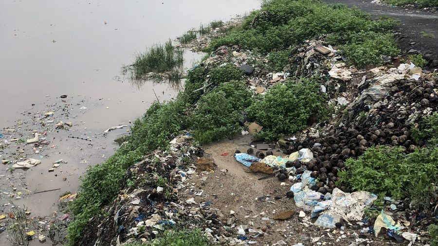 Plastic pollution along the riverbank in Mumbai, India